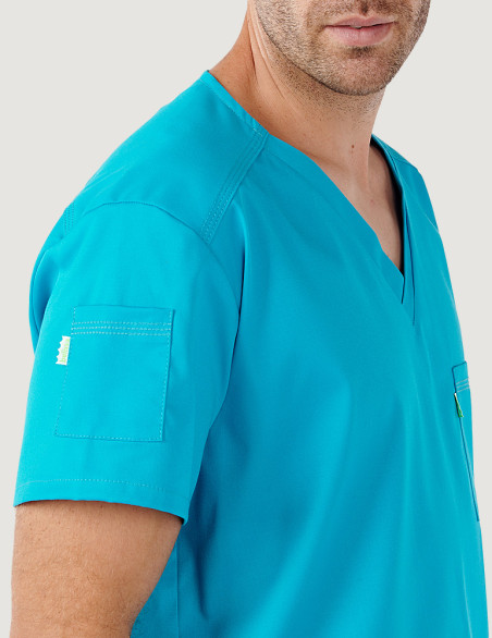 Tunique médicale unisexe Pablo col en V couleur bleu océan  - Détail poche manche droite - Marque Belissa